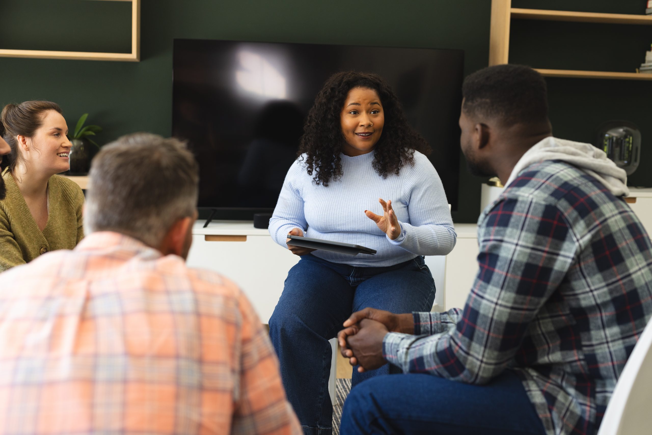 Diverse,Group,Of,Friends,And,Female,Therapist,With,Tablet,In